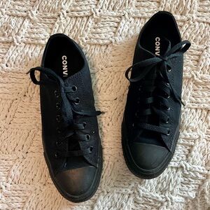 black-on-black low top Converse sneakers